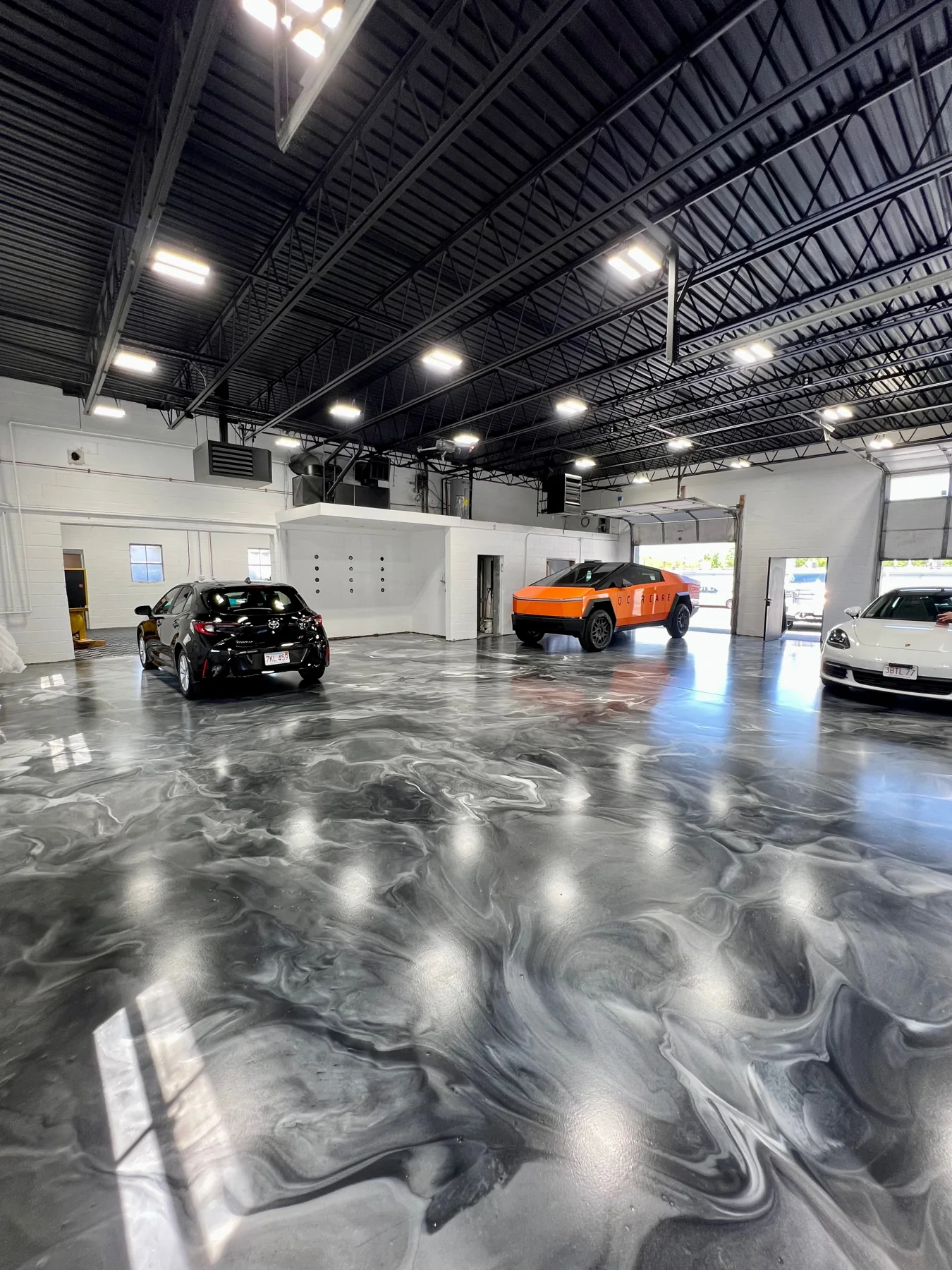 Metallic gray floor in the Q Car Care studio, featured in the EpoxyMax inspiration collection